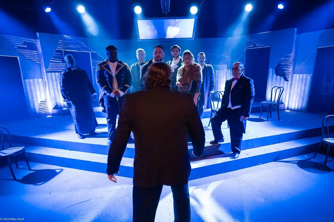 Cole Marshall as Dr. Jekyll addressing the Board of Governors in Players by the Sea's production of <em>Jekyll & Hyde</em>.